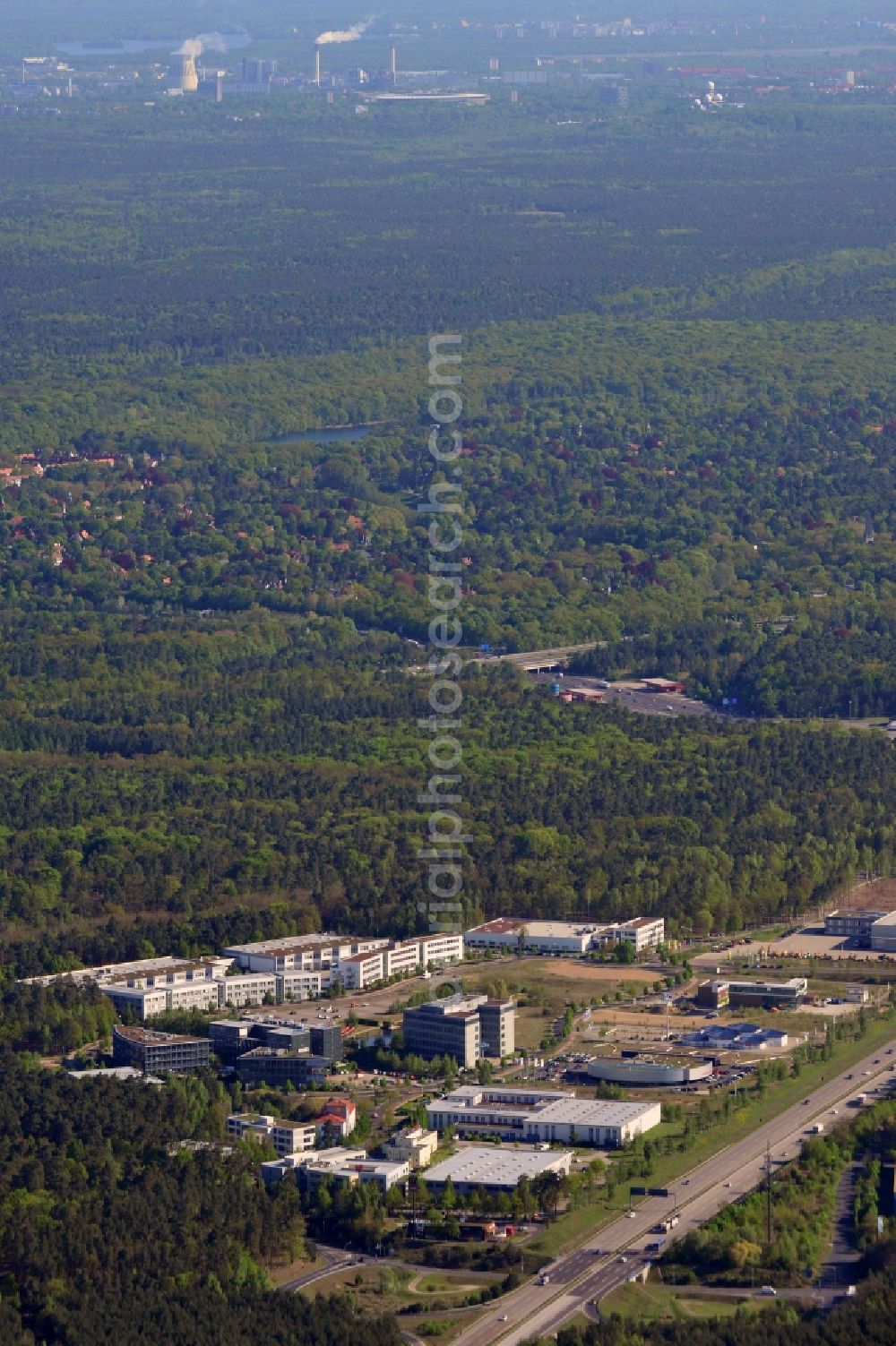 Kleinmachnow from above - Business Campus Europarc Dreilinden in Kleinmachnow in the state Brandenburg. The commercial area with its stores, shopping facilities and business building complexes is located on federal motorway A115 and is surrounded by forest. The site is a location of ebay