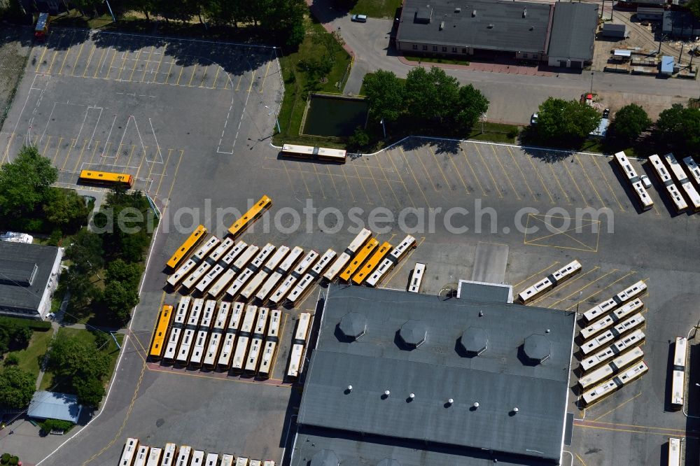 Aerial photograph Warschau - Busses at the bus garage in the Mokotow District in Warsaw in Poland. The garage with its workshops, halls and parking lots is located on Jana Pawla Woronicza street. Several busses of the public transportation are parked here