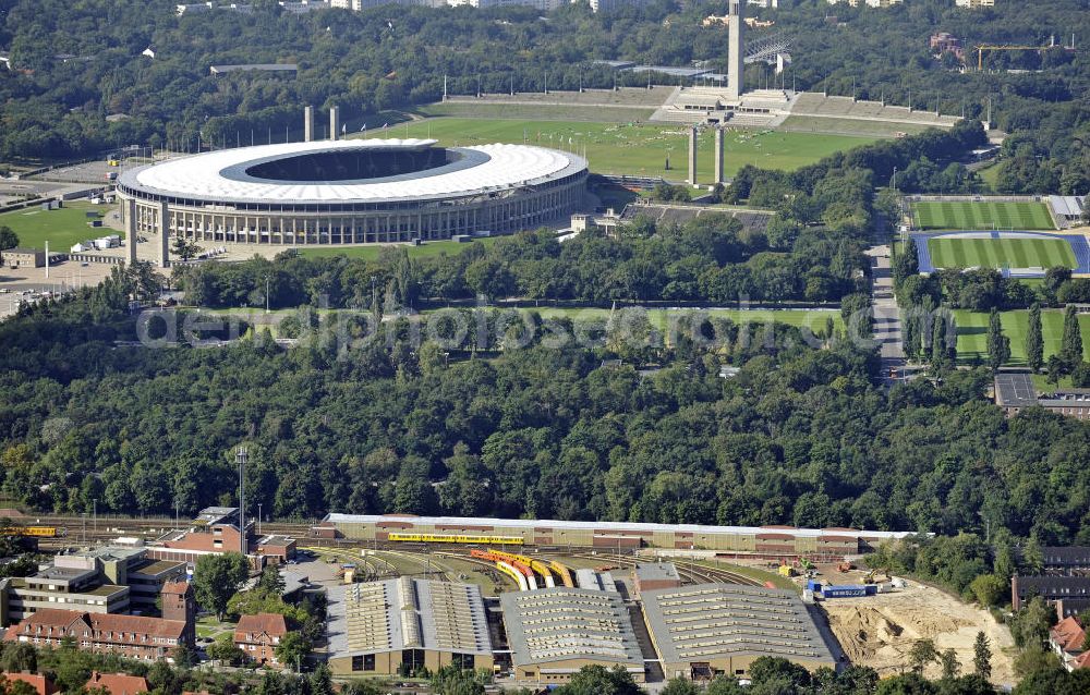 Aerial image Berlin - Blick auf die BVG-Betriebswerkstatt Grunewald (vorn) am Berliner Olympiastadion. View of the BVG operation workshop Grunewald (front) at the Berlin Olympic Stadium.