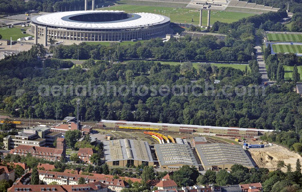 Aerial photograph Berlin - Blick auf die BVG-Betriebswerkstatt Grunewald (vorn) am Berliner Olympiastadion. View of the BVG operation workshop Grunewald (front) at the Berlin Olympic Stadium.