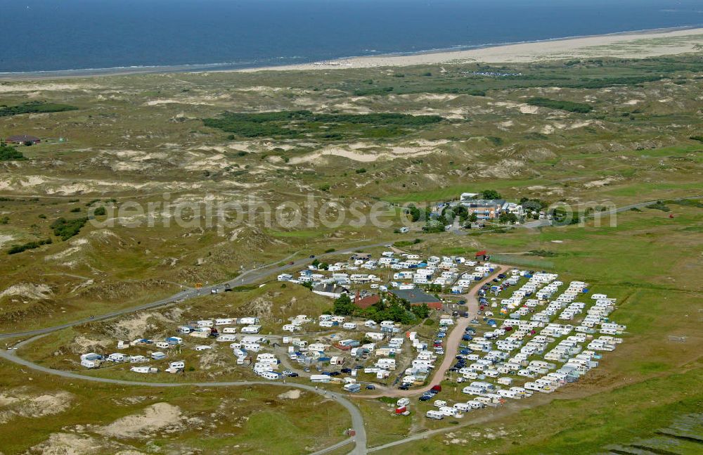 Norderney from the bird's eye view: Blick auf den Campingplatz Um Ost auf der ostfriesischen Insel Norderney. Der Campingplatz liegt etwas 5 km vom Hafen entfernt und liegt am Rand des Nationalparks Niedersächsisches Wattenmeer. View of the campsite Um Ost on the East Frisian island of Norderney. The campsite is located 5 km from the port and is situated on the edge of National Park Wadden Sea. http://