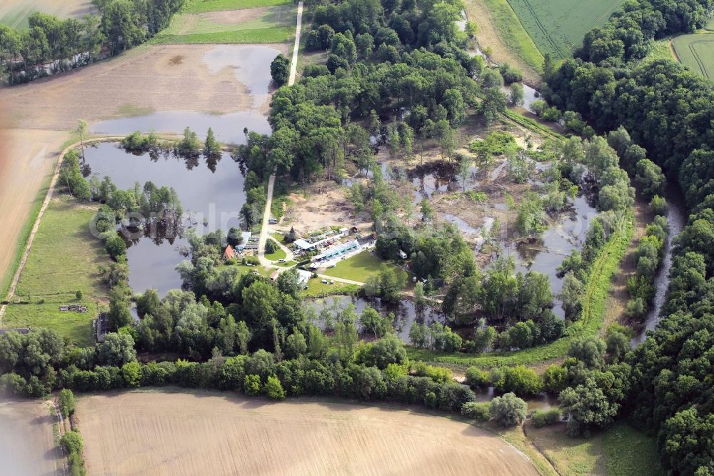 Aerial image Jena - A few days after the Saale flood 2013 at the campsite on Ostbad in Jena in Thuringia to see flood areas. The situation in the floodplain meadows under the Jenzig and the water flowing down the Gemdenbach led to a rapid flooding, the camping operation was temporarily suspended