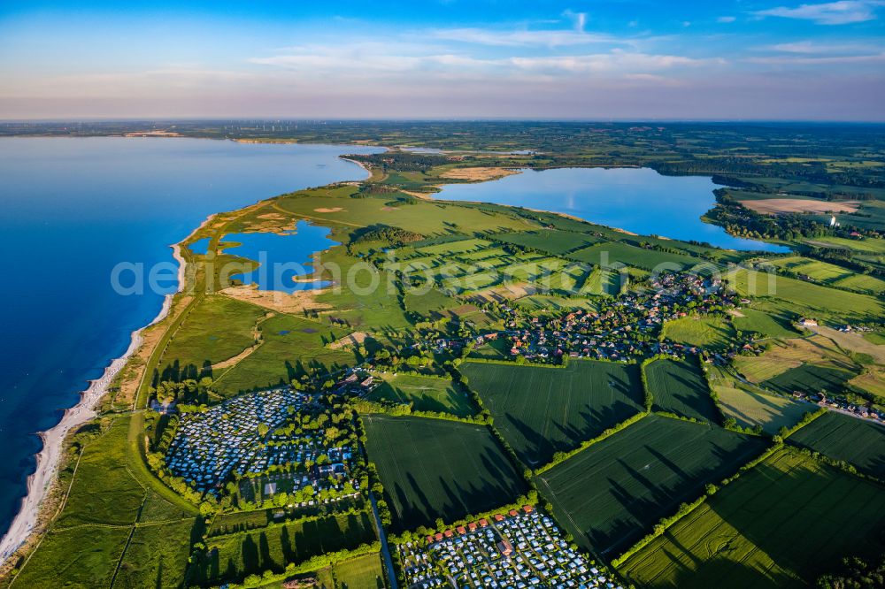 Behrensdorf from above - Campsite with caravans and tents on the lake shore in Behrensdorf at the baltic coast in the state Schleswig-Holstein, Germany