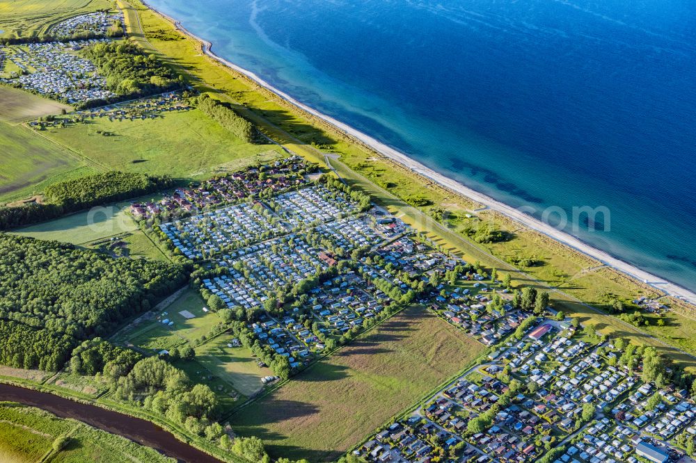 Behrensdorf from the bird's eye view: Campsite with caravans and tents on the lake shore in Behrensdorf at the baltic coast in the state Schleswig-Holstein, Germany