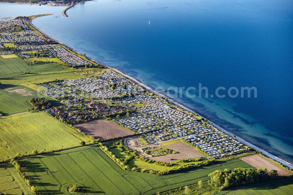 Neukirchen from the bird's eye view: Campsite with caravans and tents on the shores of the Baltic Sea in the district Ostermade in Neukirchen in the state Schleswig-Holstein, Germany