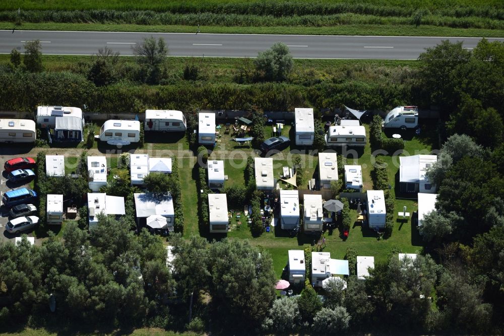 Wustrow from the bird's eye view: Camping site with caravans and motorhomes in Wustrow in the state of Mecklenburg - Western Pomerania. The site is located on L21 road in the Southwest of the sea resort Wustrow