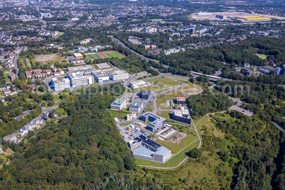 Aerial image Bochum - Campus building of the university Ruhr-Universitaet Bochum overlooking the health campus with a construction site for the new building of the company building of the think about IT GmbH in the district Querenburg in Bochum in the state North Rhine-Westphalia, Germany