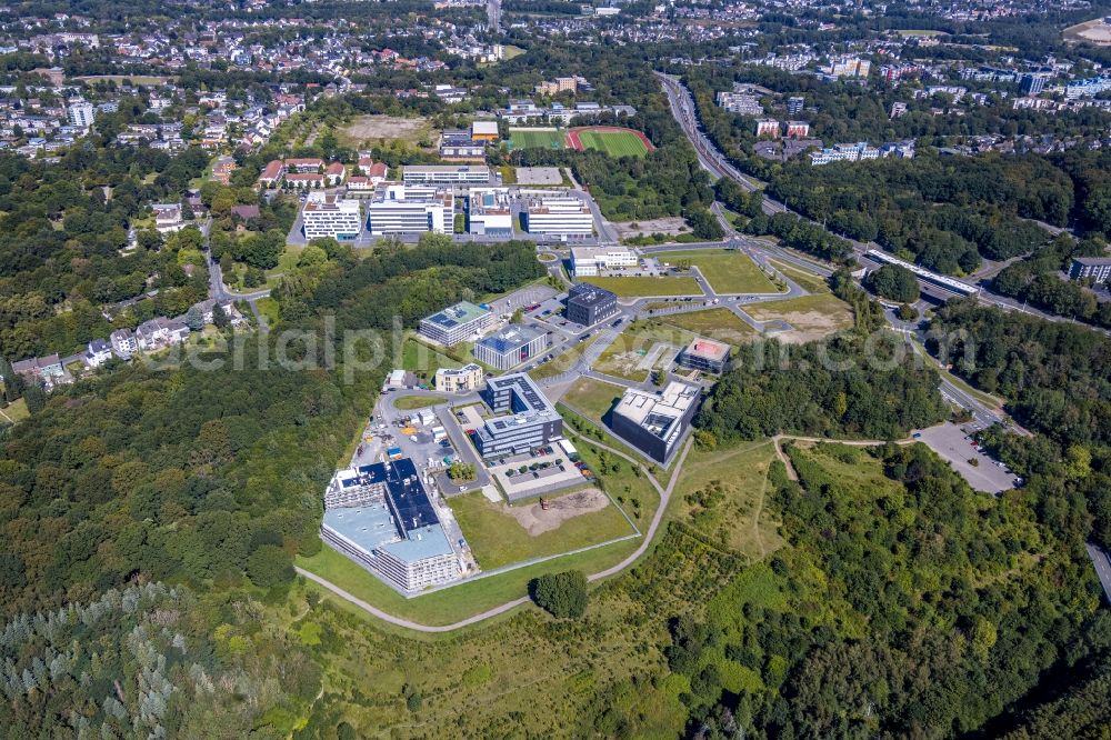 Aerial photograph Bochum - Campus building of the university Ruhr-Universitaet Bochum overlooking the health campus with a construction site for the new building of the company building of the think about IT GmbH in the district Querenburg in Bochum in the state North Rhine-Westphalia, Germany