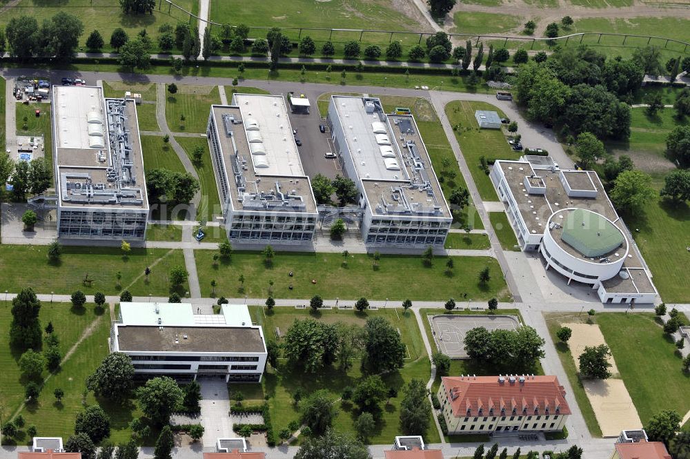 Aerial photograph Magdeburg - Blick auf den Campus der Hochschule Magdeburg-Stendal. Der Campus zwischen Elbauenpark und dem Herrenkrug wurde zunächst von Wehrmacht und später sowjetischer Armee genutzt, bevor 1992 die Sanierung bestehender und Errichtung neuer Gebäude und schließlich der Einzug der Hochschule erfolgte. View of the campus of the University of Applied Science of Magdeburg-Stendal. The campus between Elbauenpark and Herrenkrug was first used by the Wehrmacht and later Soviet army before 1992, the rehabilitation of existing and construction of new buildings, and finally the arrival of the university took place.