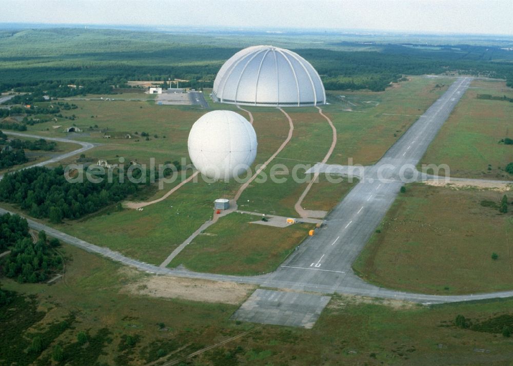 Brand from above - Cargo Lifter Hall and AirCrane balloon on the grounds of the Cargo Lifter AG on fire in the state of Brandenburg