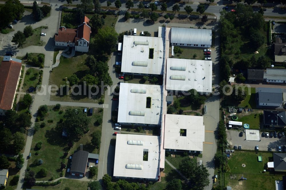 Oranienburg from above - Caritas workshops in Oranienburg in the state of Brandenburg. The workshops and halls are located on Berliner Strasse and belong to the special needs and disabled facilities of St. Johannesberg