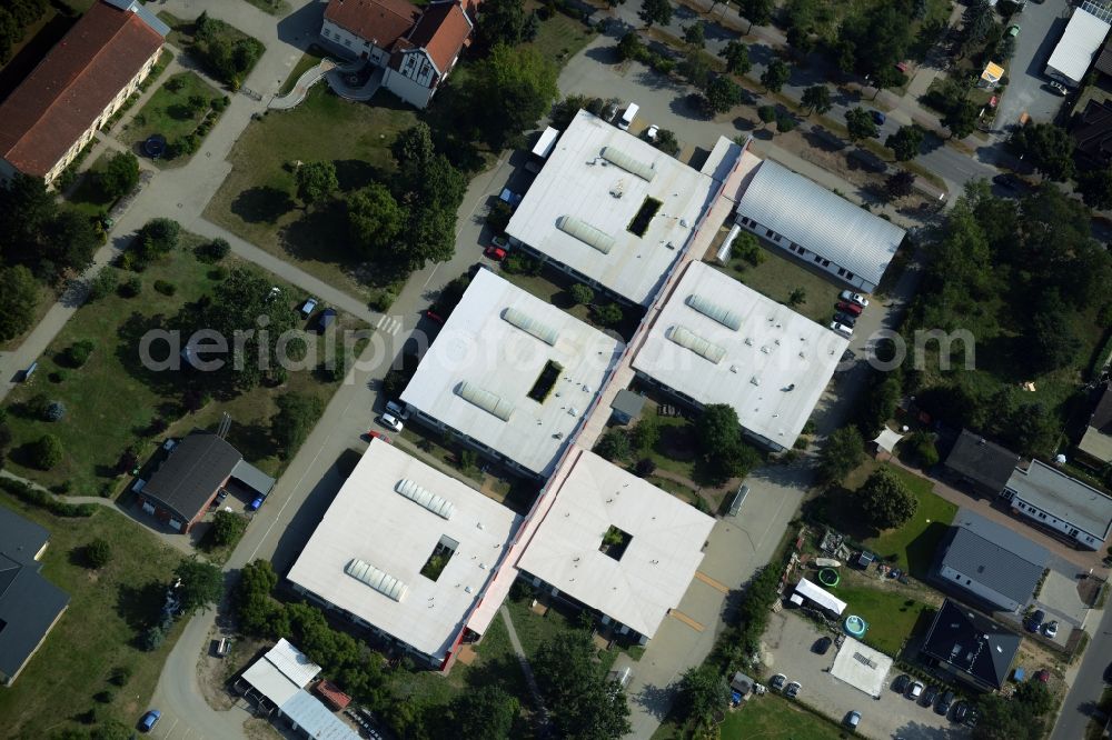 Oranienburg from the bird's eye view: Caritas workshops in Oranienburg in the state of Brandenburg. The workshops and halls are located on Berliner Strasse and belong to the special needs and disabled facilities of St. Johannesberg