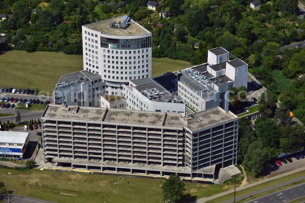 Aerial photograph Warschau - Carolina Medical Center in the Mokotow district of Warsaw in Poland. The medical center is one of the biggest orthopaedic hospitals in Europe and is specialised in sports medicine. The facilities are located on the A2 motorway and include a parking building