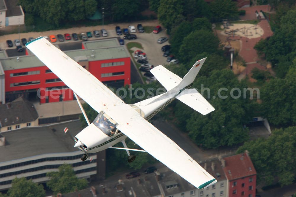 Dortmund from the bird's eye view: DORTMUND 15.05.11 Sportflugzeug vom Typ Cessna 172 D-EECN über der Dortmunder Innenstadt. Sport aircraft, a Cessna 172 with the registration D-EECN over the city of Dortmund.