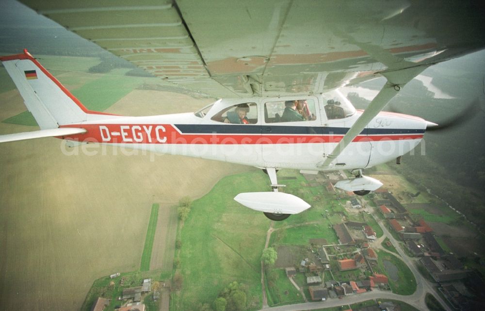 Hohenstein from the bird's eye view: Light aircraft Cessna 172 D-EGYC Agency euroluftbild.de in flight over in Hohenstein in the state Brandenburg, Germany