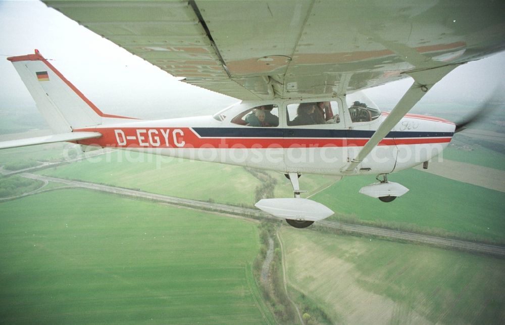 Hohenstein from the bird's eye view: Light aircraft Cessna 172 D-EGYC Agency euroluftbild.de in flight over in Hohenstein in the state Brandenburg, Germany