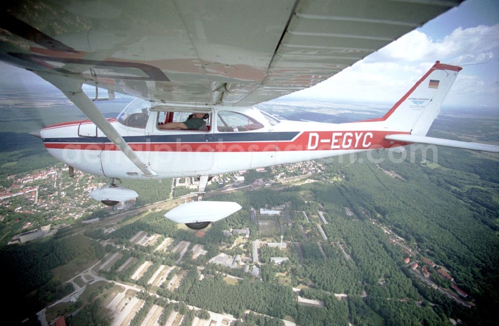 Aerial photograph Strausberg - Light aircraft Cessna 172 D-EGYC Agency euroluftbild.de in flight over Strausberg in the state Brandenburg, Germany