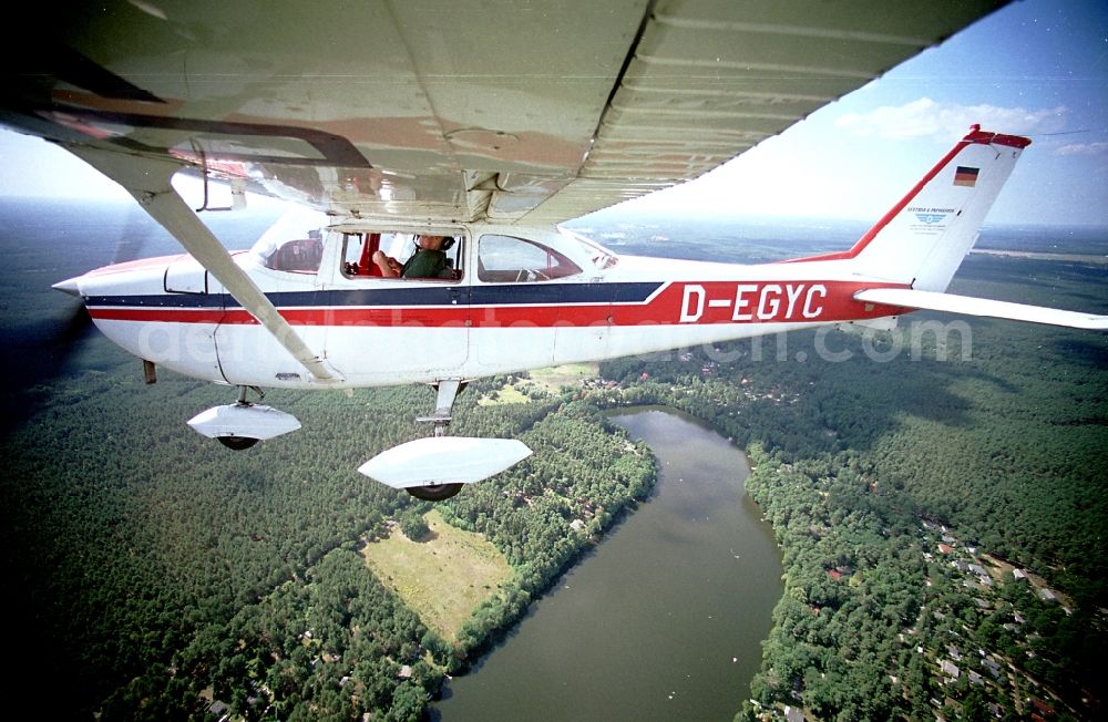 Strausberg from the bird's eye view: Light aircraft Cessna 172 D-EGYC Agency euroluftbild.de in flight over Strausberg in the state Brandenburg, Germany