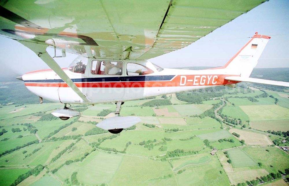 Brand / BRB from the bird's eye view: Cessna 172 D-EGYC bei einem Luftbildflug über dem Bereich Brand in Brandenburg