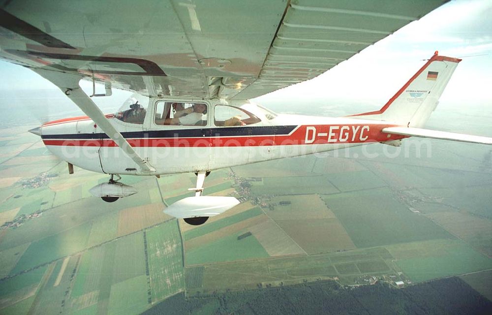 Brand / BRB from the bird's eye view: Cessna 172 D-EGYC bei einem Luftbildflug über dem Bereich Brand in Brandenburg