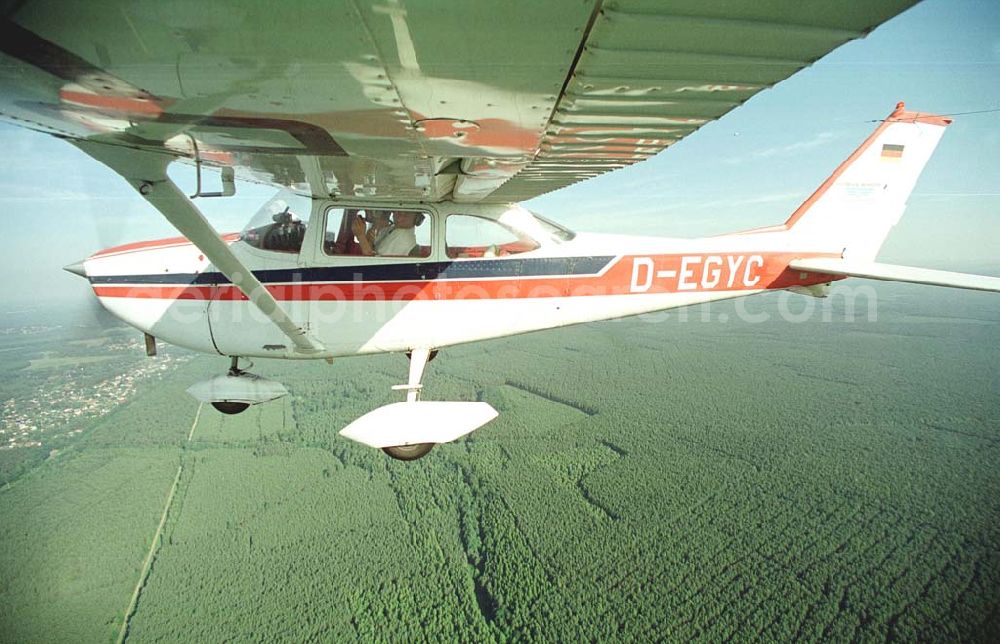 Brand / BRB from the bird's eye view: Cessna 172 D-EGYC bei einem Luftbildflug über dem Bereich Brand in Brandenburg