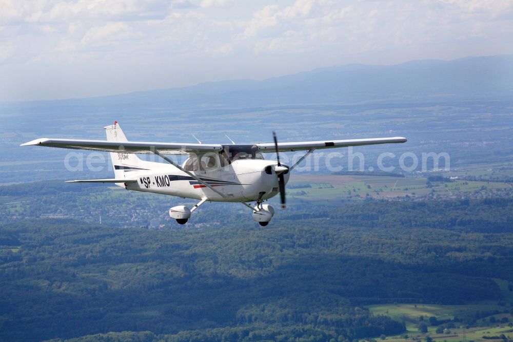 Aerial photograph Lörrach - Light aircraft Cessna 172 call sign SP-KMO over the landscape Dinkelberg close to Loerrach in the state of Baden-Wuerttemberg