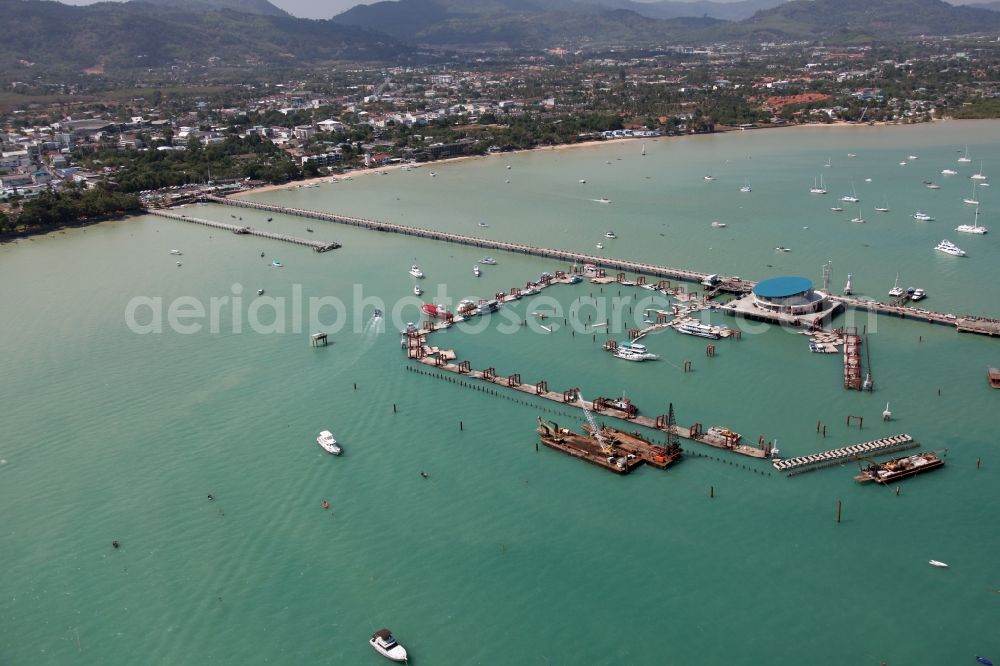 Chalong from the bird's eye view: In Chalong bay outside the city Chalong on Phuket Island in Thailand is the Chalong Pier with berths for boats and yachts