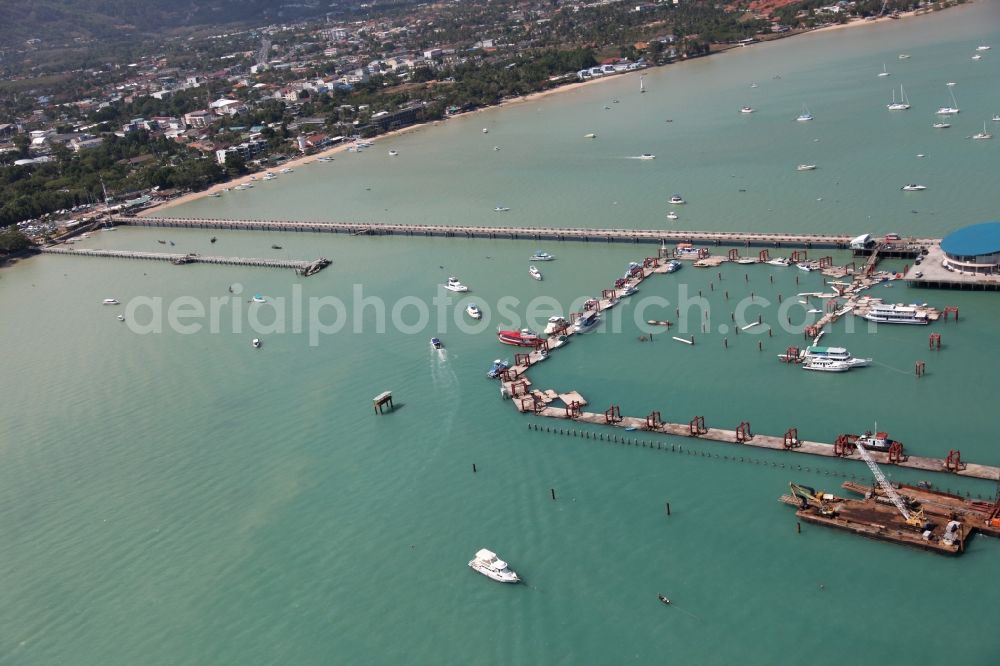 Aerial image Chalong - In Chalong bay outside the city Chalong on Phuket Island in Thailand is the Chalong Pier with berths for boats and yachts