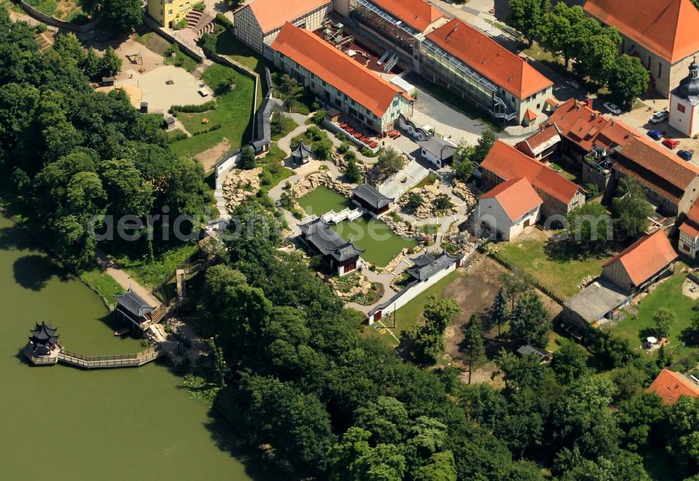 Weißensee from above - At the Gondelteich Weissensee in Thuringia emerged in recent years, a Chinese garden. The Chinese Garden connects directly to the old town and was designed as part of the State Garden Show. Several buildings on the Chinese model as the gateway to the foresight of the Pavillion of scented water and lake-pavilion form the structural framework for the garden landscape. Typical plants and garden elements round off the picture