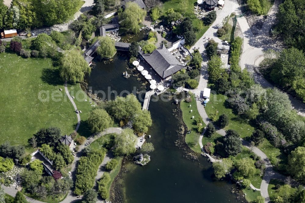 Berlin from the bird's eye view: Chinese Tea House and pond in the Chinese Garden part of the premises of the IGA 2017 in the district of Marzahn-Hellersdorf in Berlin, Germany. The main attraction of the international garden show will be the Gaerten der Welt which include the Chinese Garden and small lake