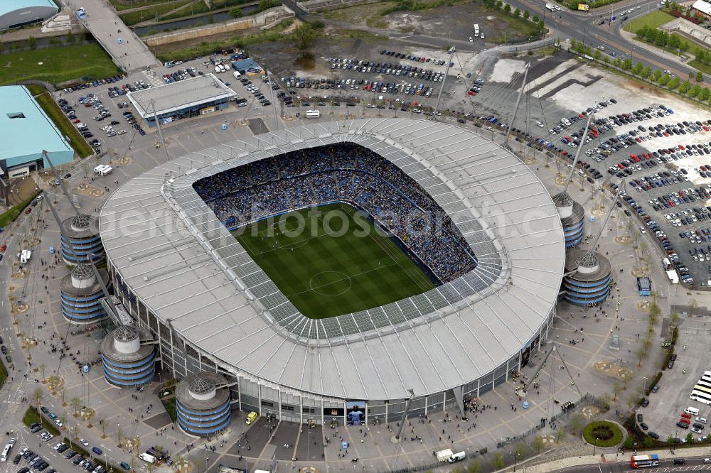 Manchester from the bird's eye view: Blick auf das City of Manchester Stadion. Umgangssprachlich wird das Stadion auch COMS, Eastlands, The Blue Camp oder Sportcity genannt. Es ist die Heimspielstätte des Fußballvereins Manchester City. View of the City of Manchester Stadium. It is the home ground of the football club Manchester City.