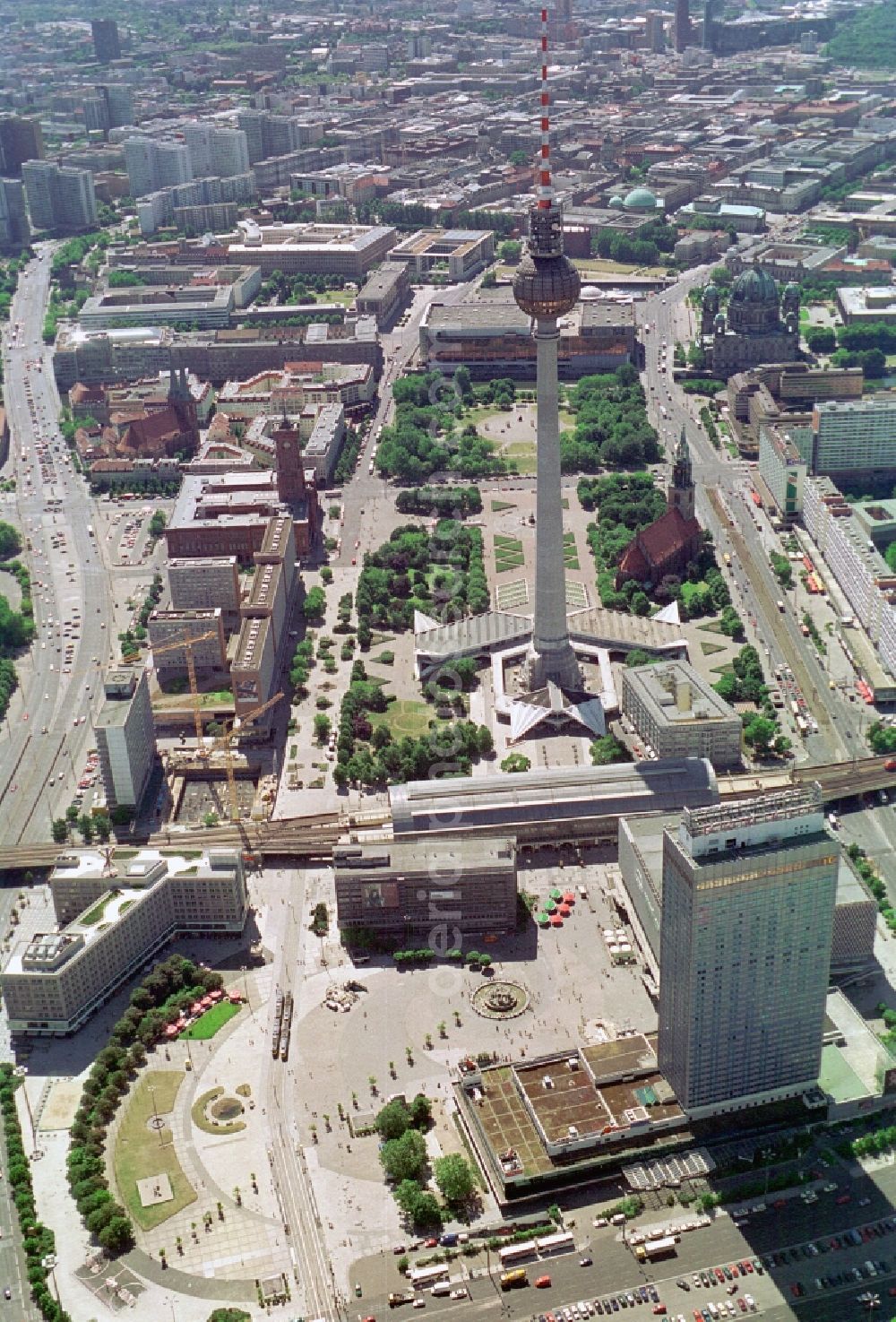 Aerial photograph Berlin - View on the Alexanderplatz in the City-East of Berlin-Mitte. Good to see are the Nikolai Quarter, the red city hall, the TV tower, the Marx and Engels Forum , the Rathauspassagen, the Palace of the Republic, the Ministry of Foreign Affairs, Berlin Cathedral, the former Forum Hotel and the construction site of the cinema Cubix