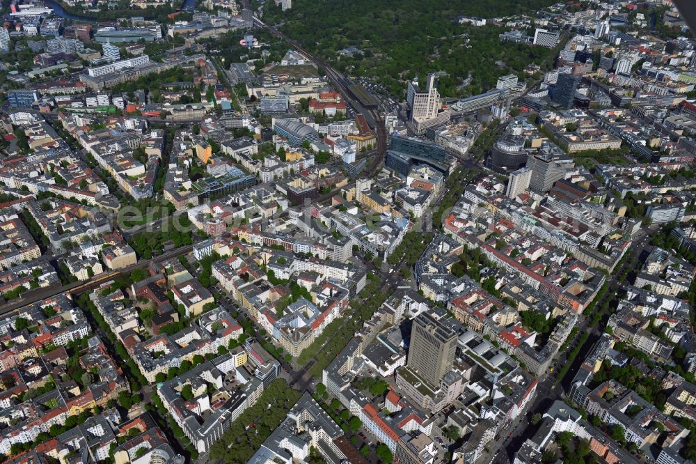 Aerial photograph Berlin - Im Hintergrund ist das Hochhaus Steglitzer Kreisel an der Schlossstraße zu erkennen. With the Kurfuerstendamm Lietzenburger Street and Kant road crossing three major shopping streets the district of Charlottenburg-Wilmersdorf of Berlin. Situated in the attractive residential and business location in the City West, there are numerous attractions and shopping. On Breitscheidplatz is consistent with the Kaiser-Wilhlem Memorial Church, a landmark of the capital. With the Zoo, the Savigny Platz and the Los Angeles Platz area is beautiful green and recreational facilities. Shopping centers such as the bikini-house, the Europa Center, the Kuhdam??-Eck, the Neues Kranzler Eck and the style works are popular destinations for shoppers. The Zoofenster with the luxury Waldorf Astoria Hotel on Breitscheidplatz and the high-rise at getting on in years Kudamm Karree are the tallest buildings in the downtown area