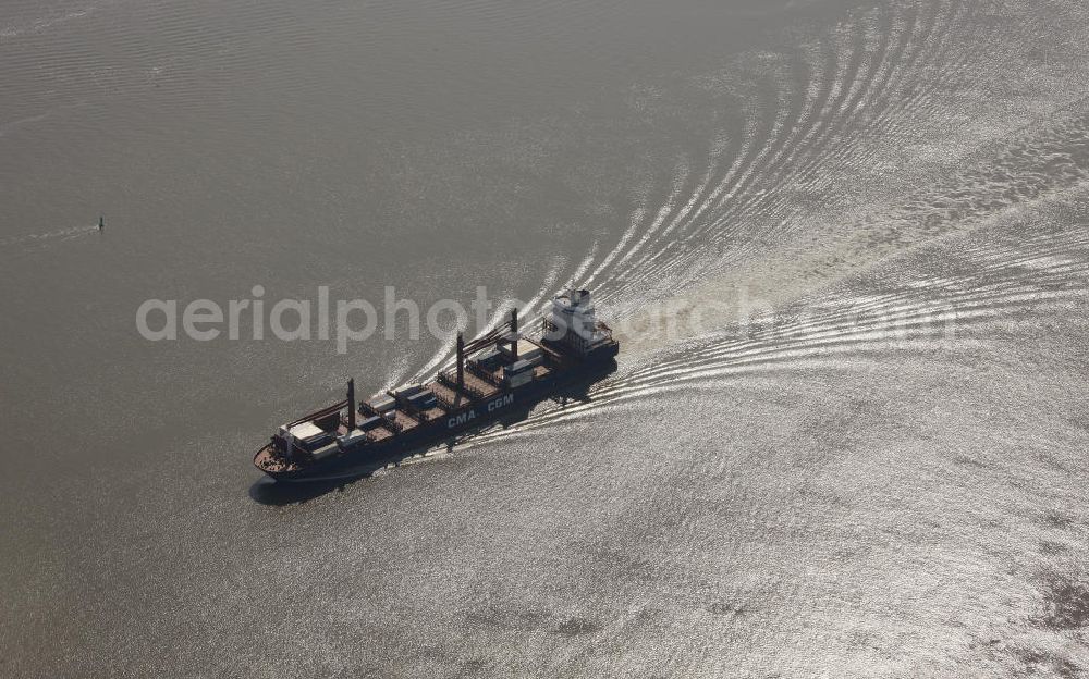 Aerial image Brunsbüttel - Containerschiff des Unternehmen CMA CGM auf der Elbe. Container ship of the CMA CGM company at the Elbe river.