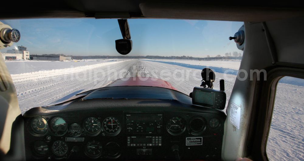 Marl from the bird's eye view: The cockpit of a Cessna C152 sport aircraft at the start of the winter on snow-covered runway of the aerodrome Marl