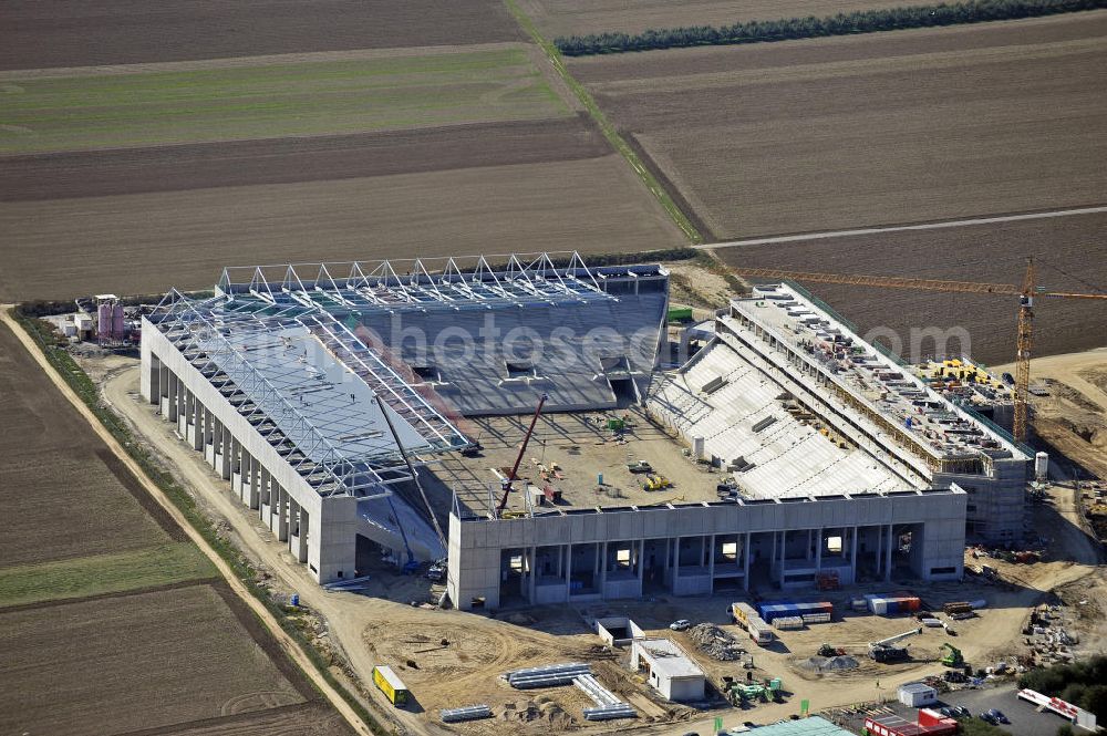 Mainz from the bird's eye view: Blick auf den Neubau der Coface Arena im Stadtteil Bretzenheim. Das neue Stadion des Fußballklubs FSV Mainz 05 soll 33.500 Plätze bieten und zu Beginn des Jahres 2011 fertiggestellt werden. Bauherr und Eigentümer ist die Grundstücksverwaltungsgesellschaft (GVG) der Stadt Mainz. Ausführende Baufirma ist die BAM Deutschland AG. View of the new Coface Arena in the district Bretzenheim. The new stadium of the football club FSV Mainz 05 will provide 33,500 seats and will be completed at the beginning of 2011. Builder and owner of the property is the real estate management society of the city of Mainz (GVG).