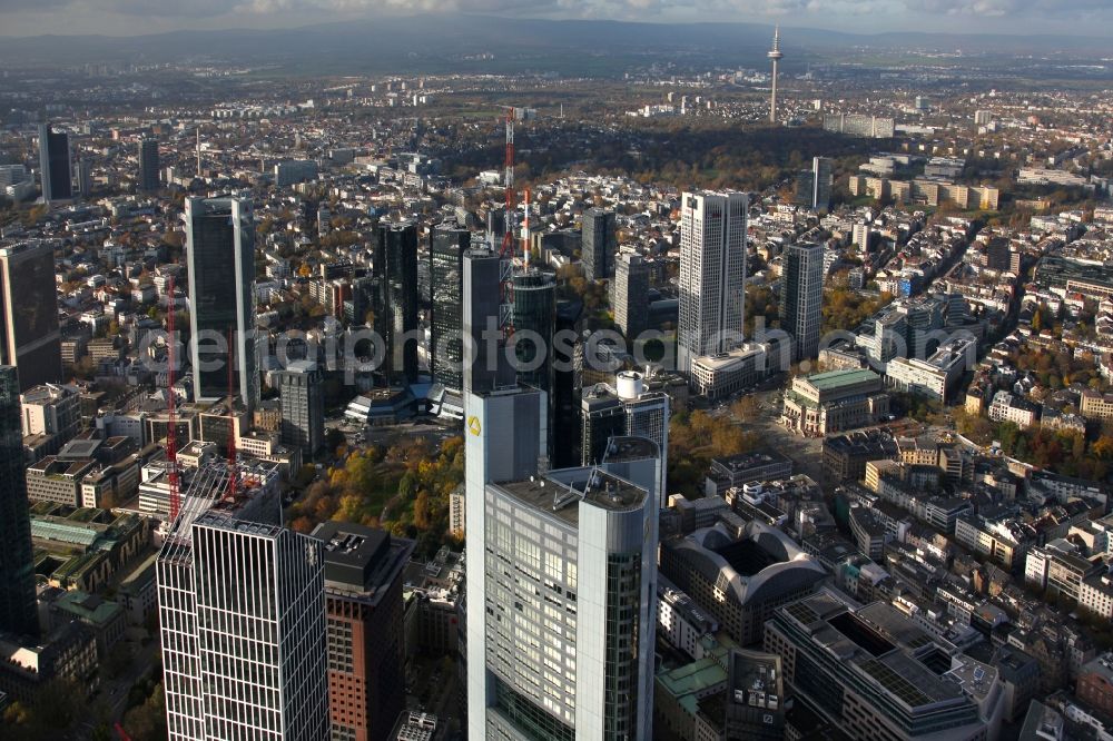 Frankfurt am Main from the bird's eye view: Cityscape of the skyscraper skyline in the banking and insurance district of the Frankfurt on the Main city center in the state Hesse. In the center, the high-rise of the Commerzbank. Foto Alfons Rath