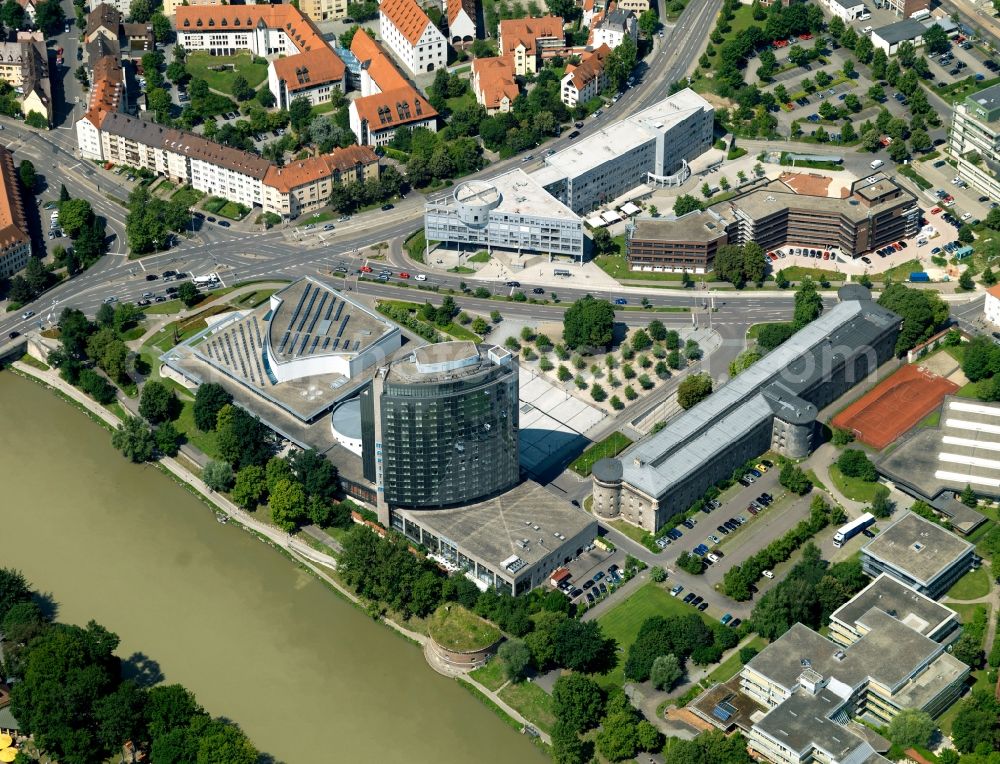 Aerial photograph Ulm - Congress Centre and Maritim Hotel in Ulm in the state of Baden-Wuerttemberg. The congress and conference centre and the hotel are well connected to the fairs and exhibition centre on the Danube riverbank. Every year it is the location of events, conferences and conventions