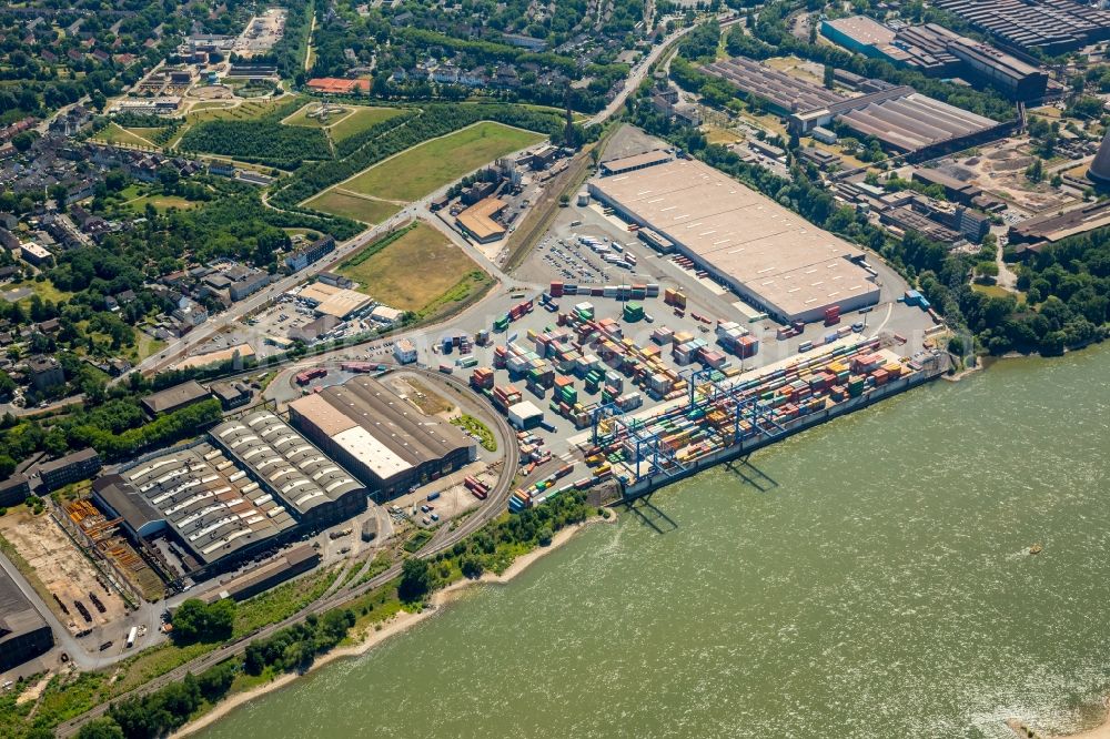 Aerial photograph Duisburg - Building complex and grounds of DIT Duisburg Intermodal Terminal in the logistics center logport on the left riverbank of the Rhine in Duisburg in the state of North Rhine-Westphalia. The center is part of the harbour duisport and located in the Rheinhausen part of Duisburg