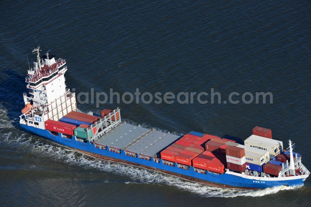 Aerial photograph Cuxhaven - Container ship - FREYA a Dutch freighter cruise in the bay of the North Sea coast near Cuxhaven in Lower Saxony