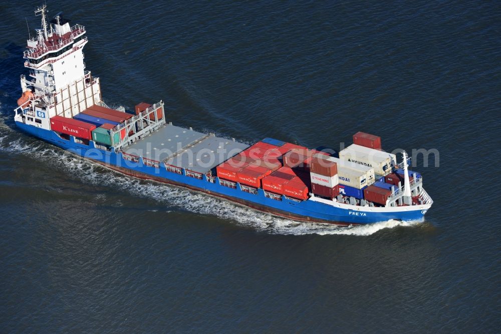 Cuxhaven from above - Container ship - FREYA a Dutch freighter cruise in the bay of the North Sea coast near Cuxhaven in Lower Saxony