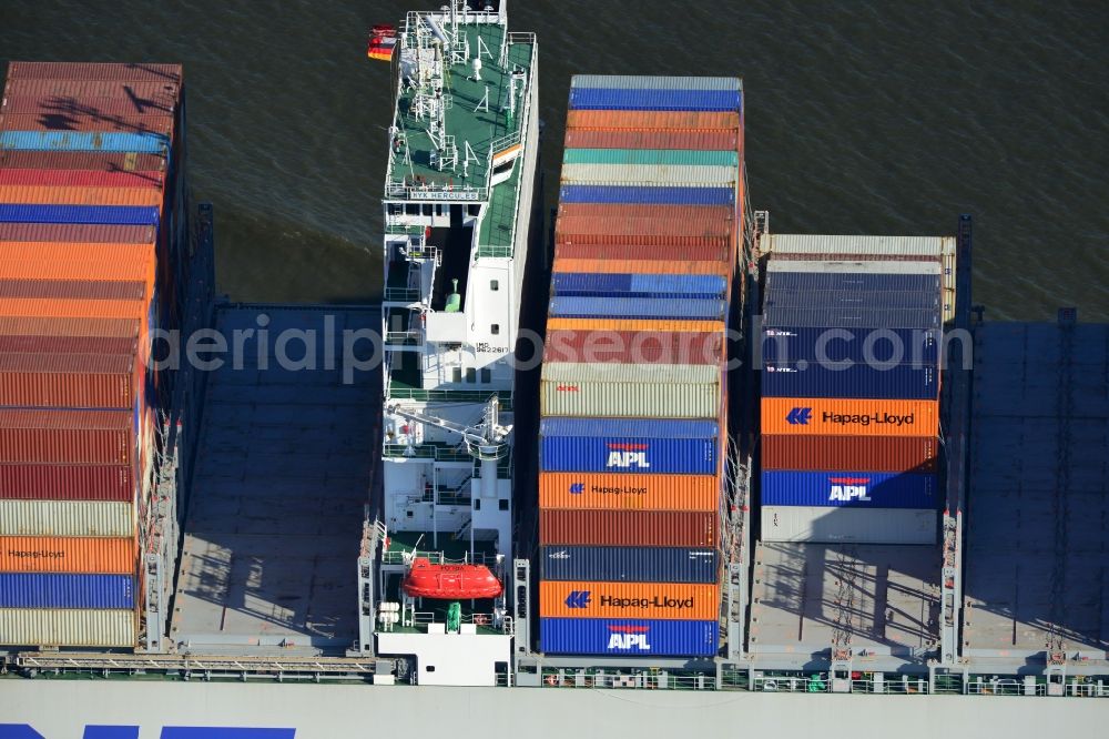 Aerial image Cuxhaven - Container ship - the cargo shipping company NYK Line NYK Hercules GmbH in driving off the North Sea coast near Cuxhaven in Lower Saxony