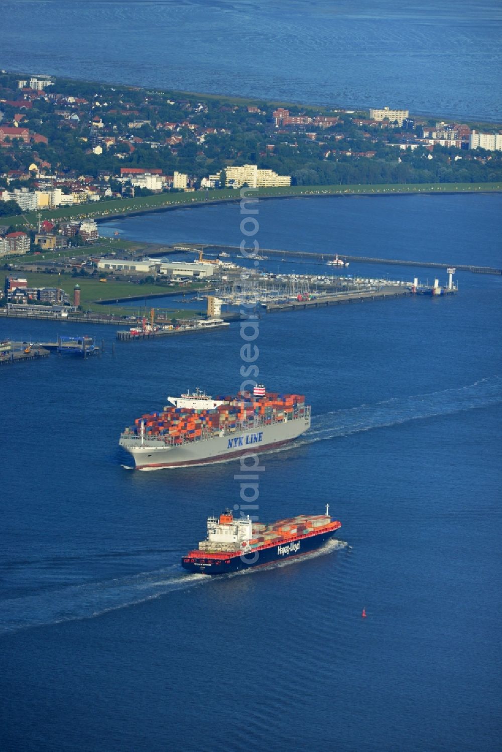 Aerial image Cuxhaven - Container ship - the cargo shipping company NYK Line NYK Hercules GmbH in driving off the North Sea coast near Cuxhaven in Lower Saxony