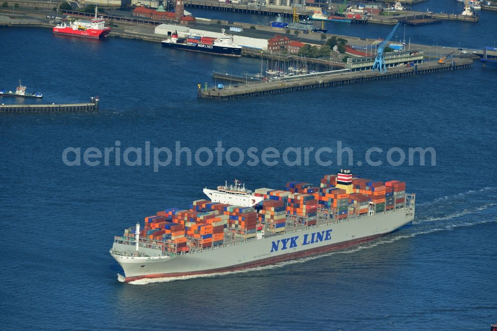 Cuxhaven from above - Container ship - the cargo shipping company NYK Line NYK Hercules GmbH in driving off the North Sea coast near Cuxhaven in Lower Saxony