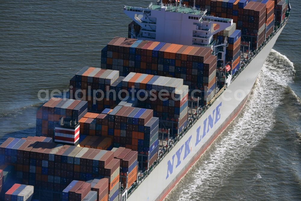 Aerial photograph Cuxhaven - Container ship - the cargo shipping company NYK Line NYK Hercules GmbH in driving off the North Sea coast near Cuxhaven in Lower Saxony