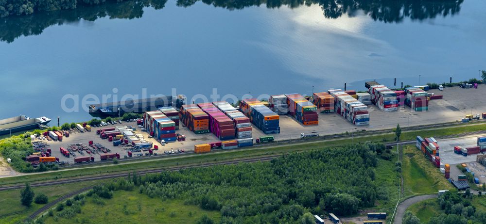 Wörth am Rhein from above - Container terminal in the container port of Contargo Woerth-Karlsruhe GmbH on the lake of the Landeshafen in the district Industriegebiet Woerth-Oberwald in Woerth am Rhein in the state Rhineland-Palatinate, Germany