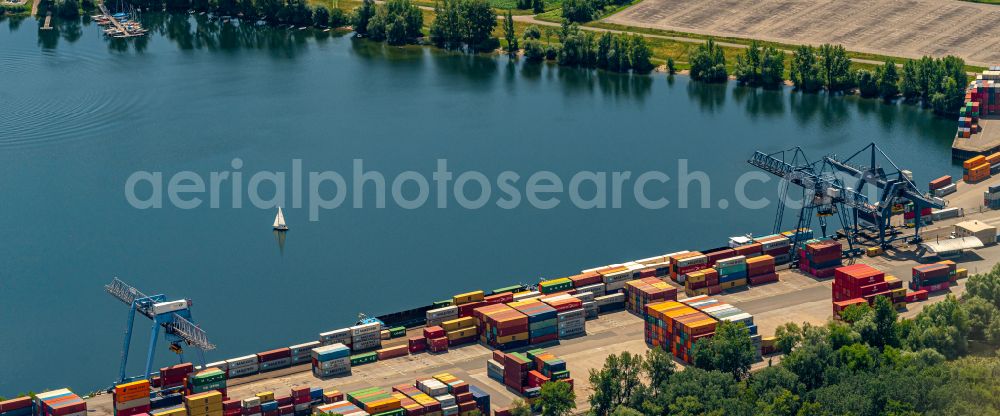 Wörth am Rhein from the bird's eye view: Container terminal in the container port of Contargo Woerth-Karlsruhe GmbH on the lake of the Landeshafen in the district Industriegebiet Woerth-Oberwald in Woerth am Rhein in the state Rhineland-Palatinate, Germany