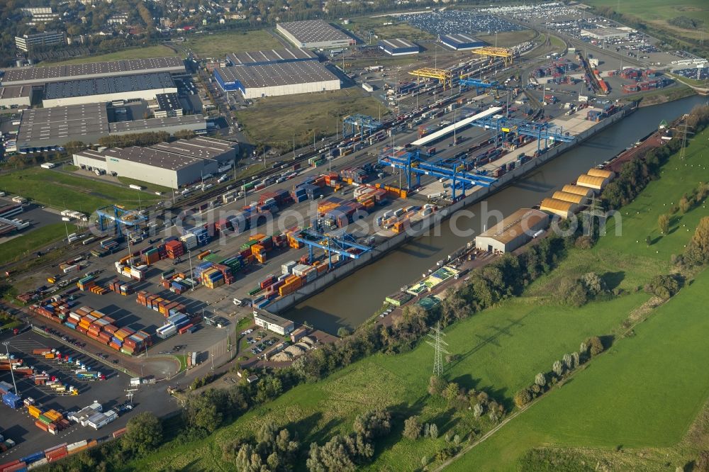 Aerial photograph Duisburg - Container terminal of the DIT Duisburg Intermodal Terminal GmbH. Unloading and loading of cargo and shipping containers on the Rhine. The terminal is located in an industrial area in Duisburg Friemersheim district in the state of North Rhine-Westphalia