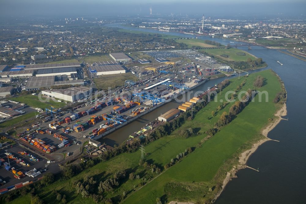 Duisburg from above - Container terminal of the DIT Duisburg Intermodal Terminal GmbH. Unloading and loading of cargo and shipping containers on the Rhine. The terminal is located in an industrial area in Duisburg Friemersheim district in the state of North Rhine-Westphalia