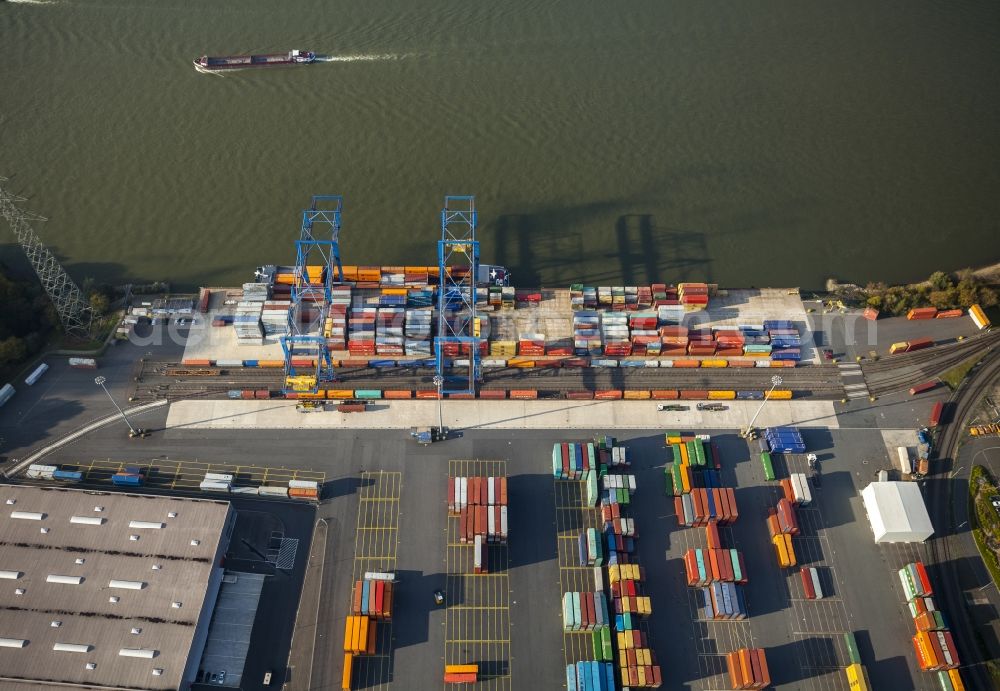 Duisburg from the bird's eye view: Container terminal of the DIT Duisburg Intermodal Terminal GmbH. Unloading and loading of cargo and shipping containers on the Rhine. The terminal is located in an industrial area in Duisburg Friemersheim district in the state of North Rhine-Westphalia